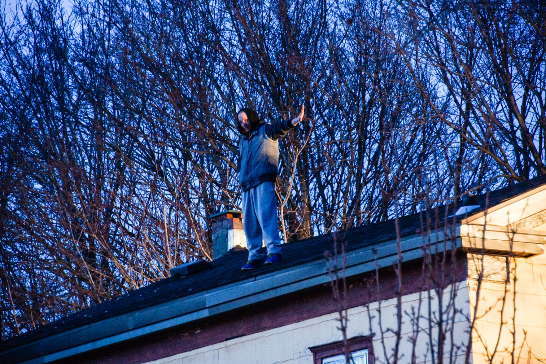 Man on roof of 51 Orchard St.